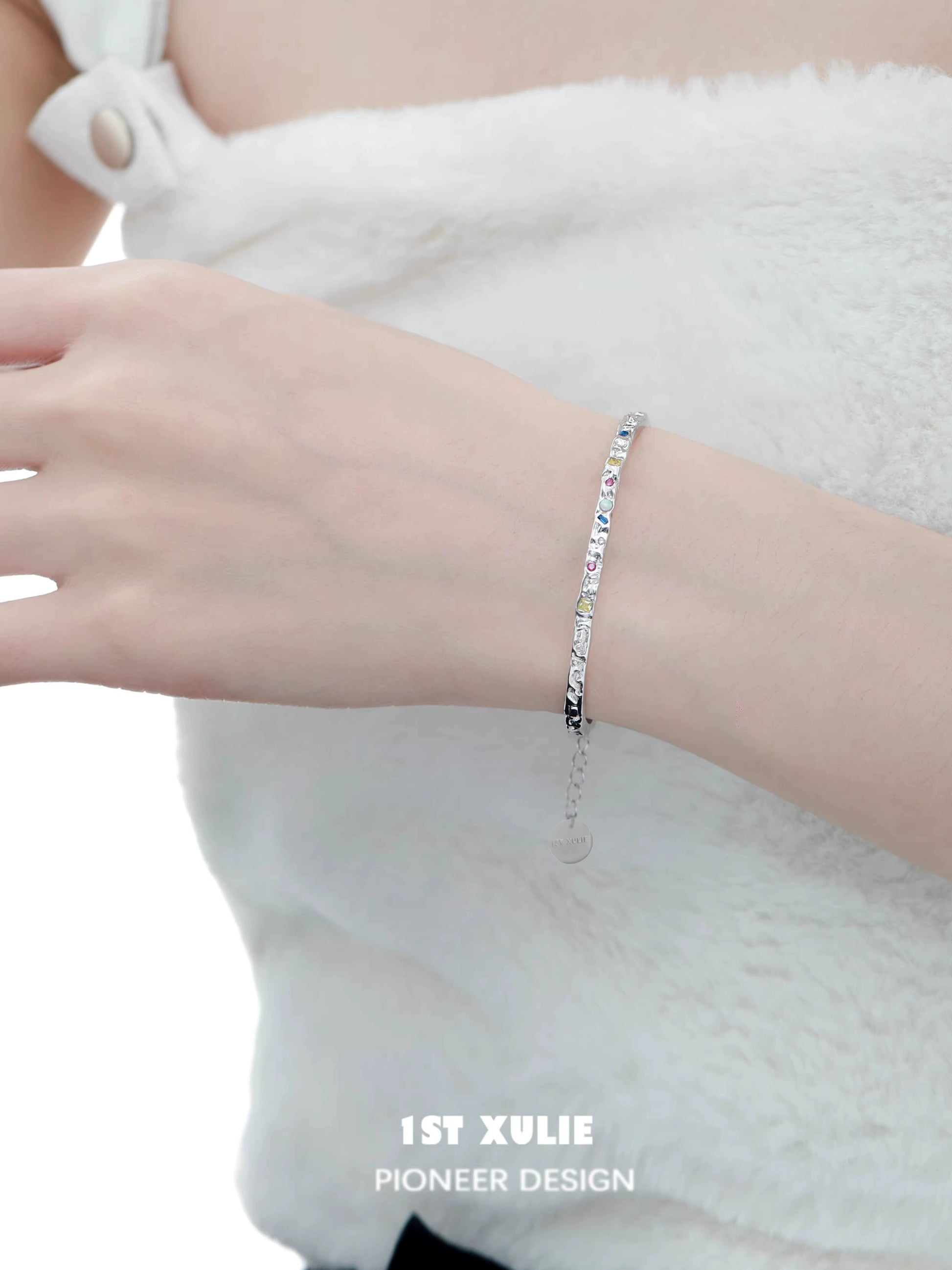 Elegant dopamine color zircon bracelet on a wrist, featuring a sparkling design for stylish occasions