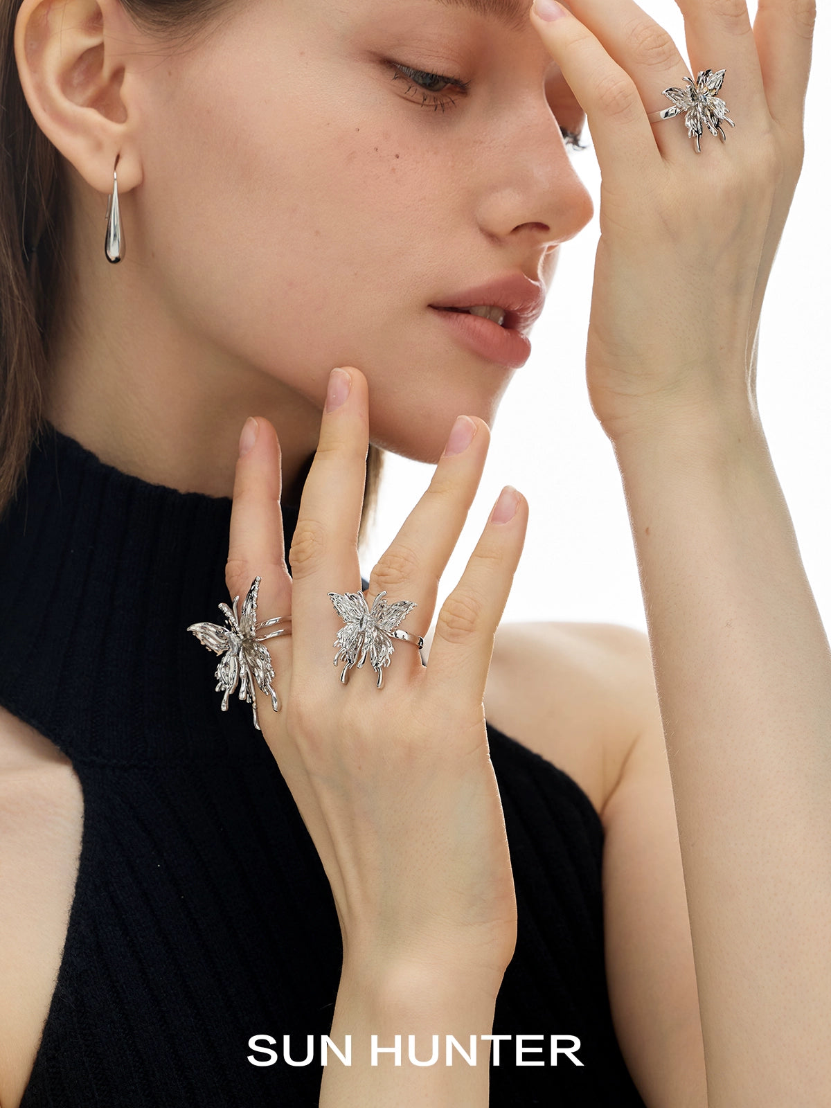 Model wearing a SUN HUNTER double-layer butterfly ring with elegant design and sparkling details