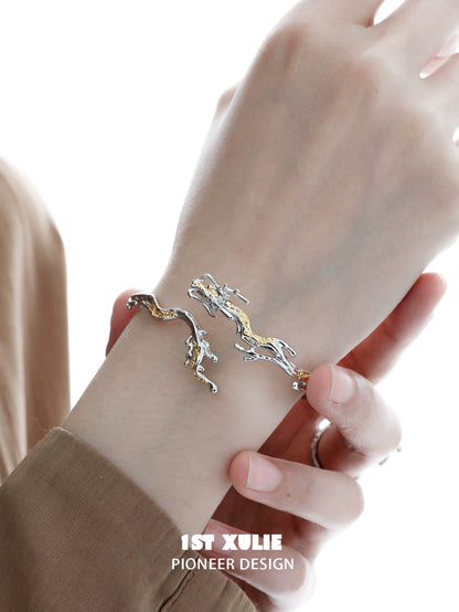 Stylish dragon bracelet for women featuring a sleek silver and gold design for a trendy look