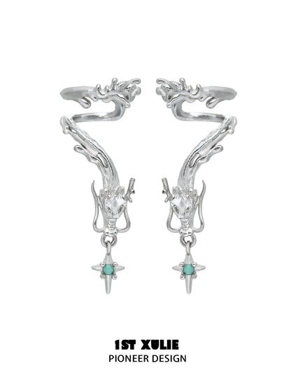 Silver dragon ear cuff jewelry featuring intricate design and turquoise accents for a unique look