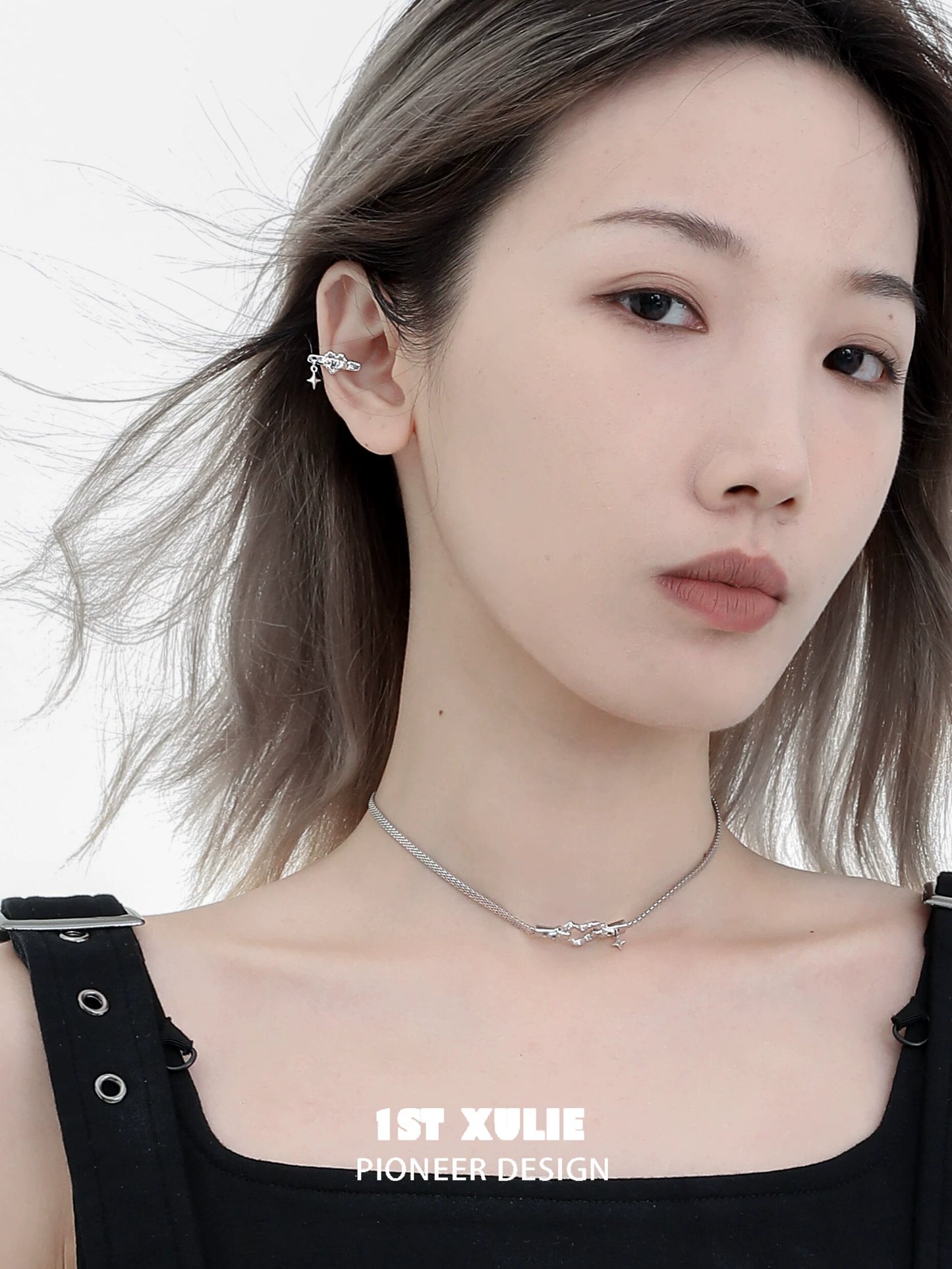 Stylish model wearing an edgy heart ear cuff showcasing modern design and unique accessory appeal