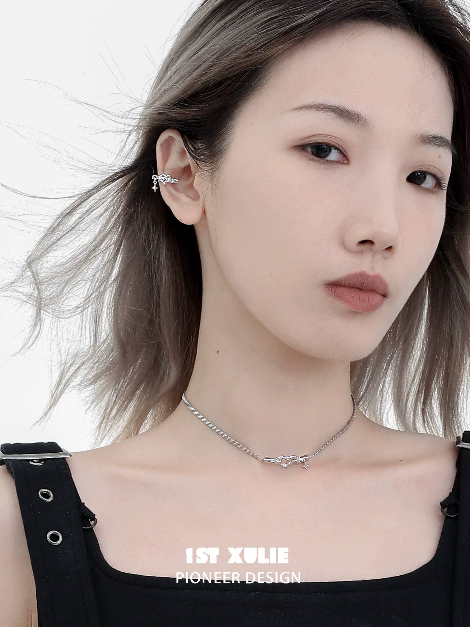 Stylish model wearing an edgy heart ear cuff showcasing modern design and unique accessory appeal