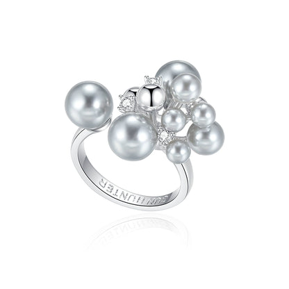 SUN HUNTER elegant pearl statement ring featuring multiple lustrous pearls and sparkling accents