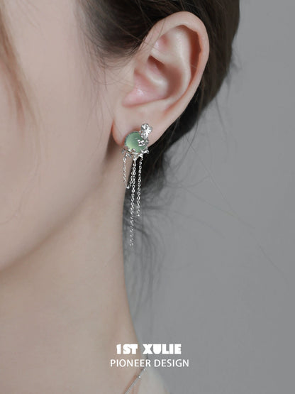 Elegant queen fringe earrings with sparkling accents and delicate chain details for a chic look