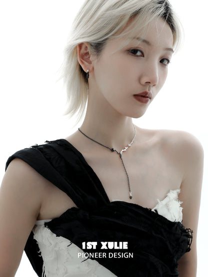 Stylish model wearing an Eternal Flame couple necklace with unique design for romantic couples