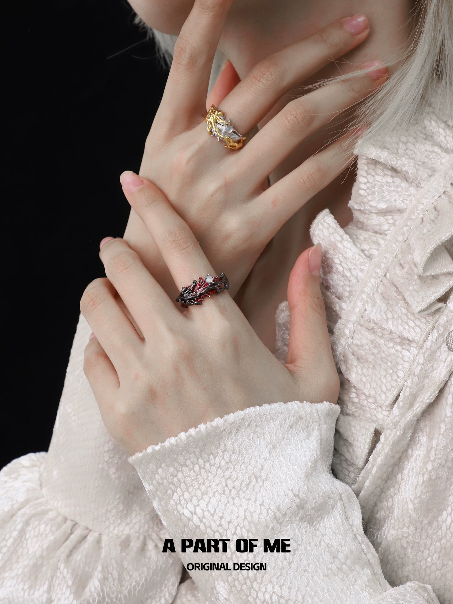 A PART OF ME feather agate ring displayed on a model's hand with elegant styling