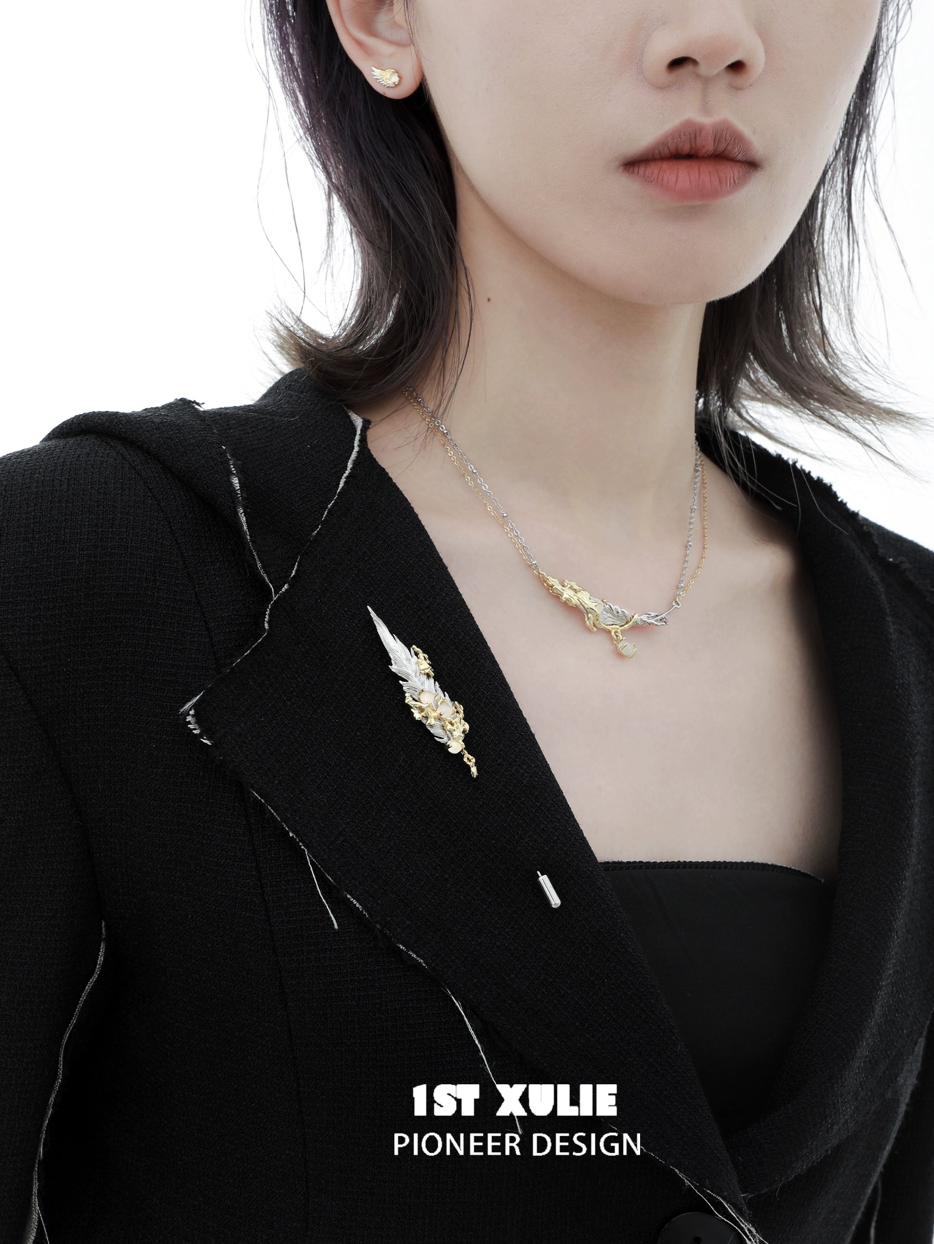 Elegant 1ST XULIE feather couple brooch displayed on a black blazer for a stylish accessory look