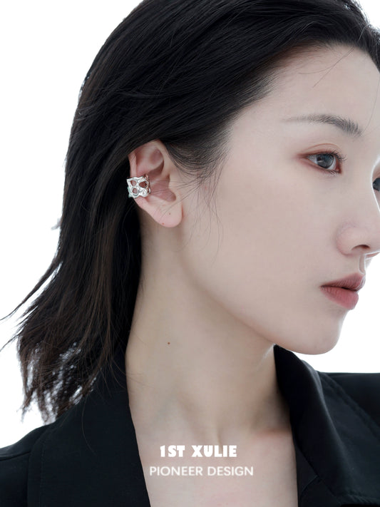 Elegant 1ST XULIE Frozen Edge Ear Cuff on Model's Ear, Showcasing Unique Design and Style