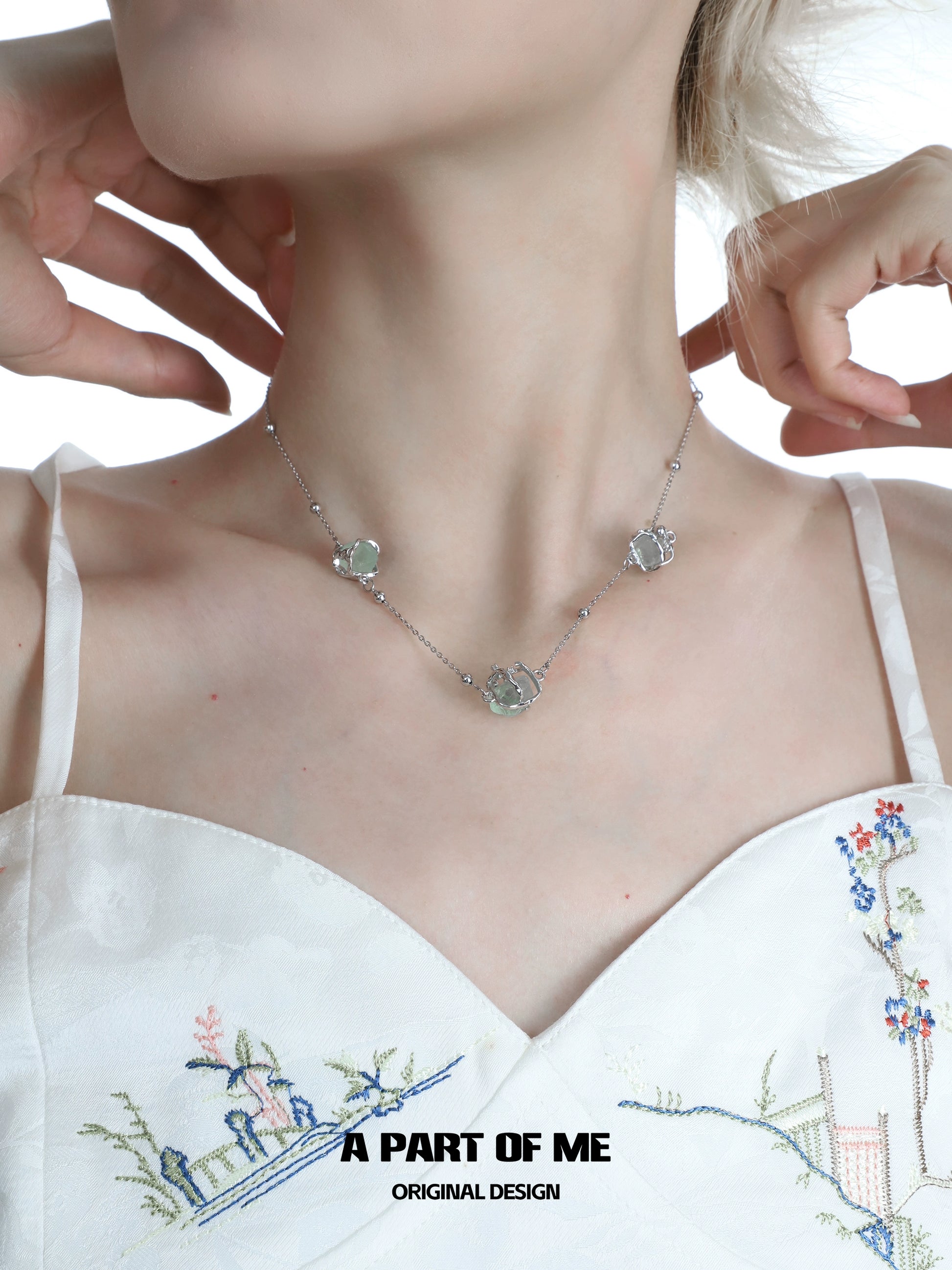 A PART OF ME flying bird fluorite necklace with delicate design featuring gemstone charms