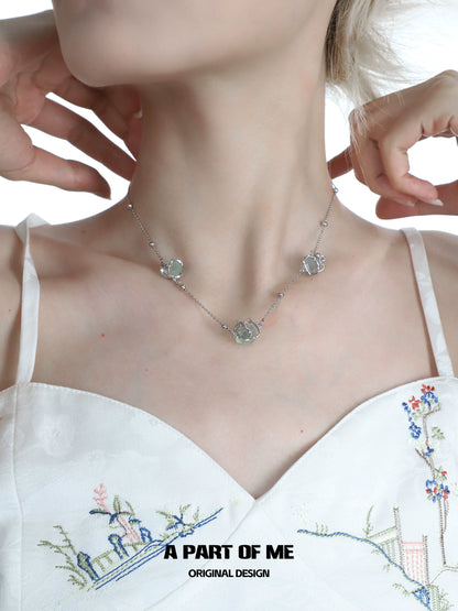 A PART OF ME flying bird fluorite necklace with delicate design featuring gemstone charms