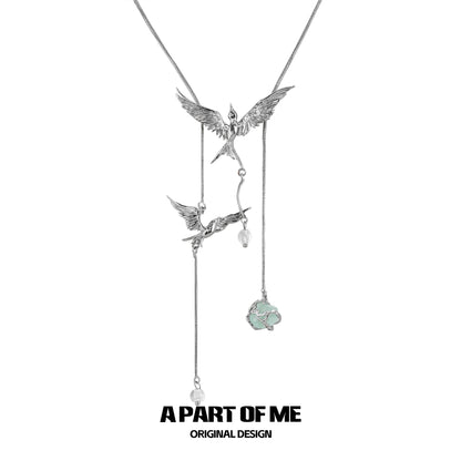 Flying bird fluorite necklace with silver birds and a fluorite pendant for a stylish look