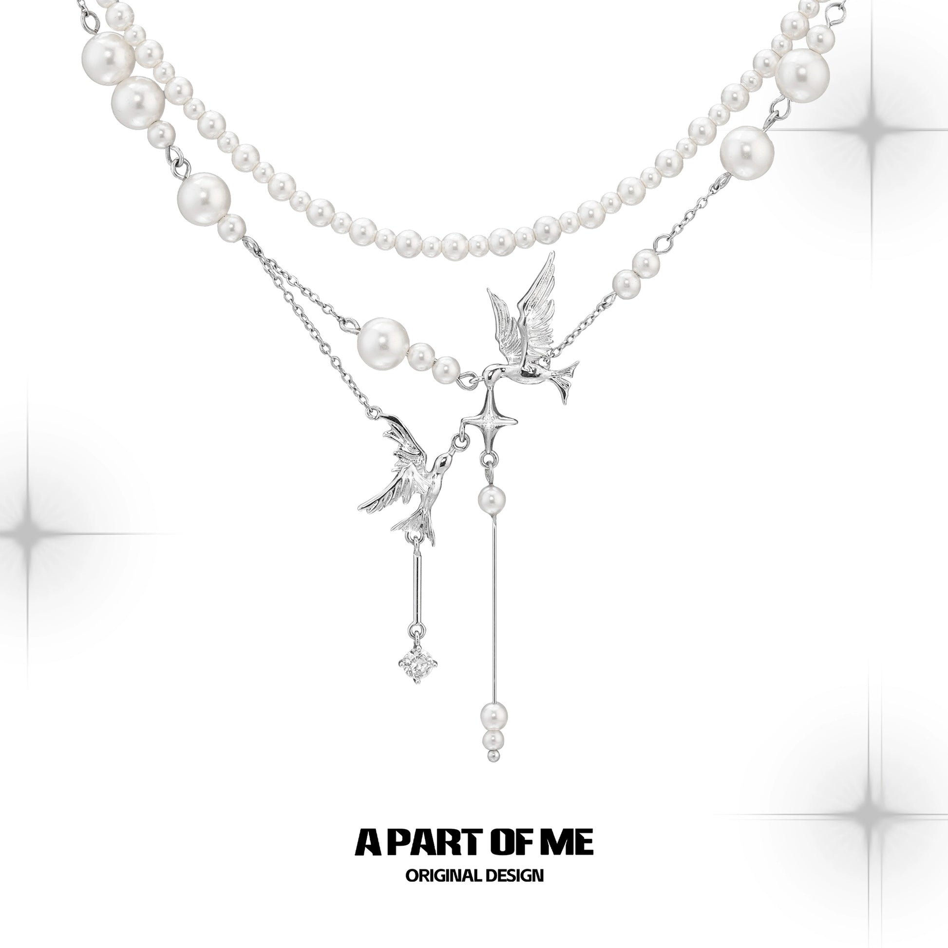 A PART OF ME flying bird pearl necklace featuring elegant bird charms and lustrous pearls