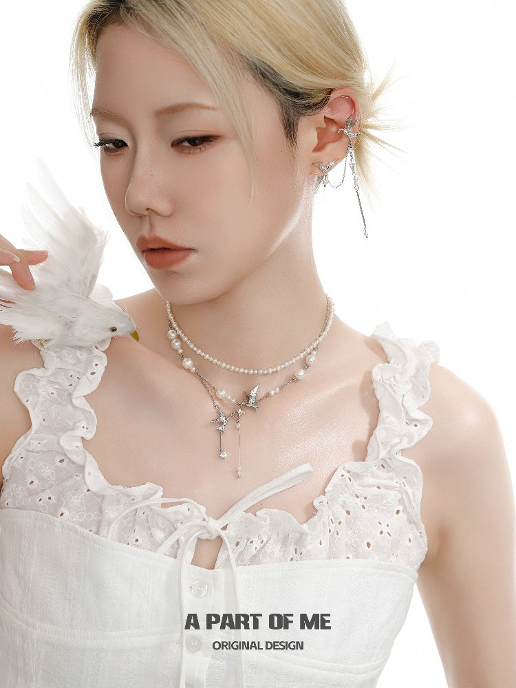 A stylish flying bird pearl necklace featuring delicate pearls and a charming bird pendant