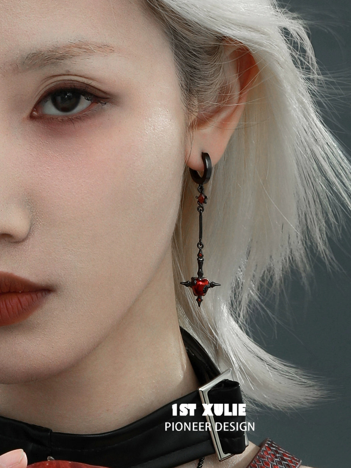 Forbidden apple serpent earrings with intricate design and red accents for a bold fashion statement
