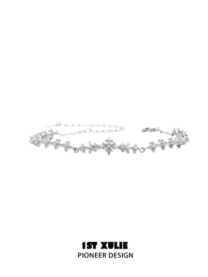 Elegant four-point star silver bracelet with sparkling accents for a stylish look