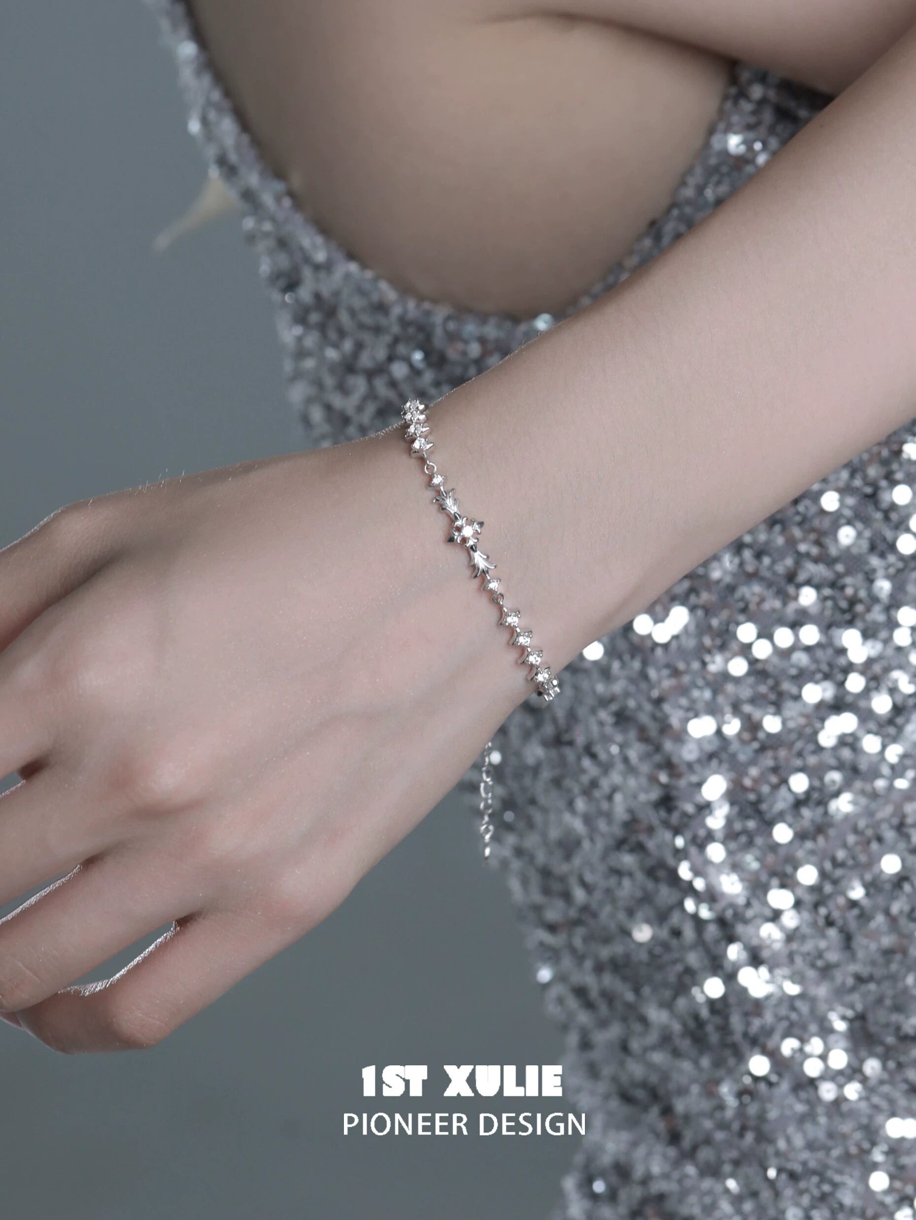 Elegant four-point star silver bracelet showcased on a hand, perfect for stylish occasions