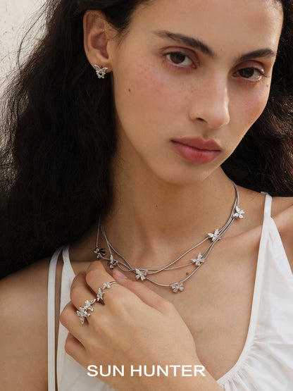 Elegant model wearing French retro butterfly ring with matching jewelry by SUN HUNTER