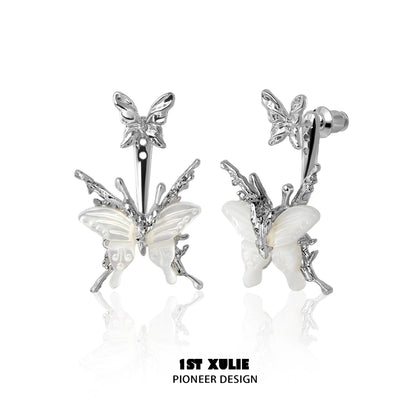 Futuristic butterfly earrings in silver with intricate design and detailed wings for a trendy look