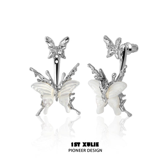 Futuristic butterfly earrings in silver with intricate design and detailed wings for a trendy look
