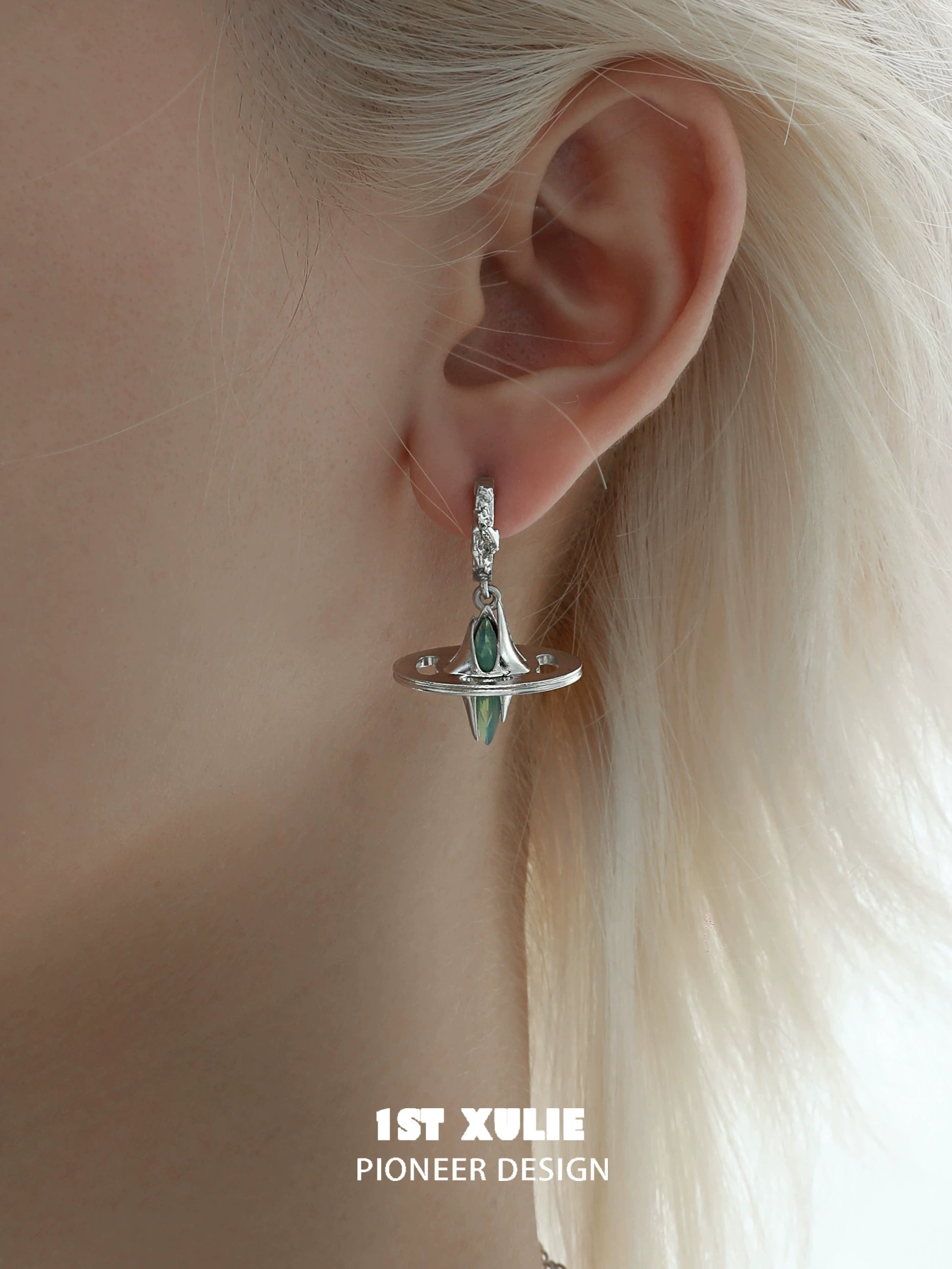 Futuristic dream core earrings featuring a sleek design with a gemstone centerpiece