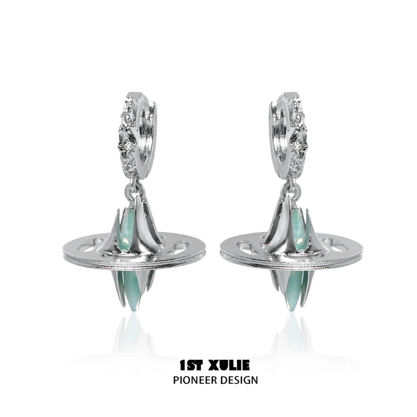 Futuristic dream core earrings by 1ST XULIE featuring silver design and teal accents