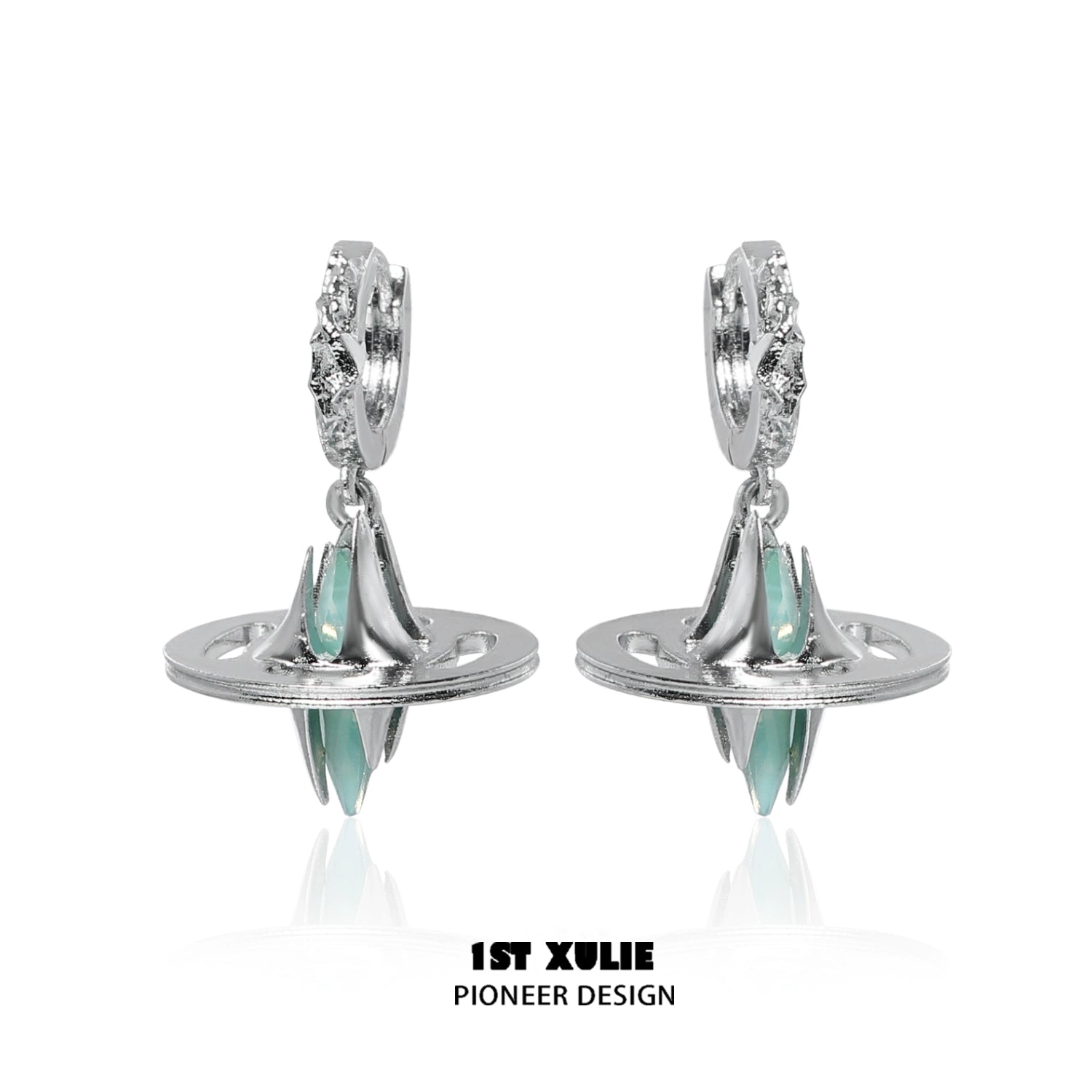 Futuristic dream core earrings by 1ST XULIE featuring silver design and teal accents