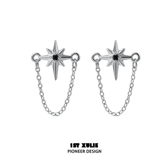 Futuristic star chain earrings in silver with striking star design and connecting chain