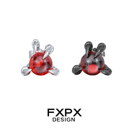 FXPX bloody dragon claw gothic earrings featuring red glass spheres with silver and black claw settings