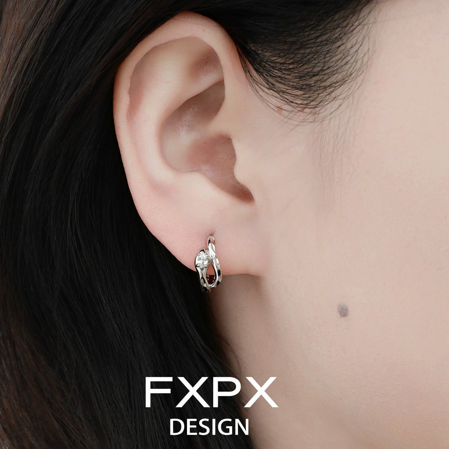 FXPX Blue and White Serpentine Zircon Earrings Elegantly Displayed on Model's Ear