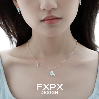 Beautiful blue cat pendant necklace by FXPX with matching earrings for a stylish look