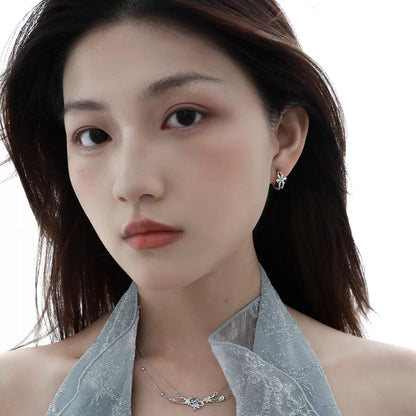 Elegant model wearing a blue crystal necklace paired with matching earrings for a stylish look