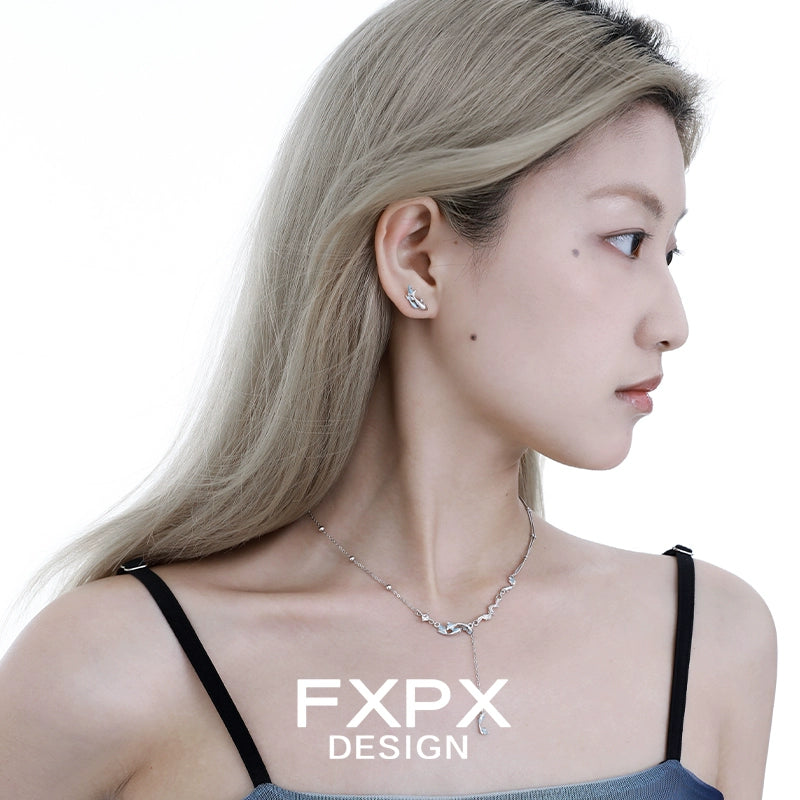 Stylish blue mermaid necklace from FXPX design worn with elegant attire
