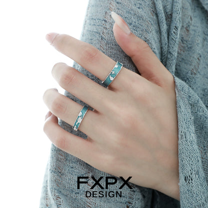 Stylish FXPX blue planet puzzle ring featuring star accents, perfect for unique jewelry lovers