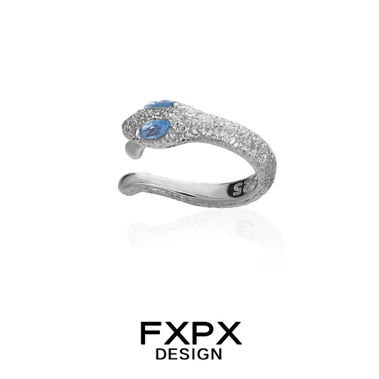 Silver FXPX blue snake ear cuff with sparkling details and two blue gemstones
