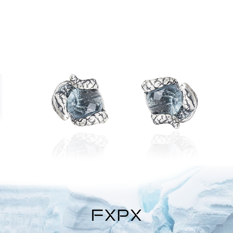 FXPX blue snake stud earrings featuring a textured design and sparkling accents