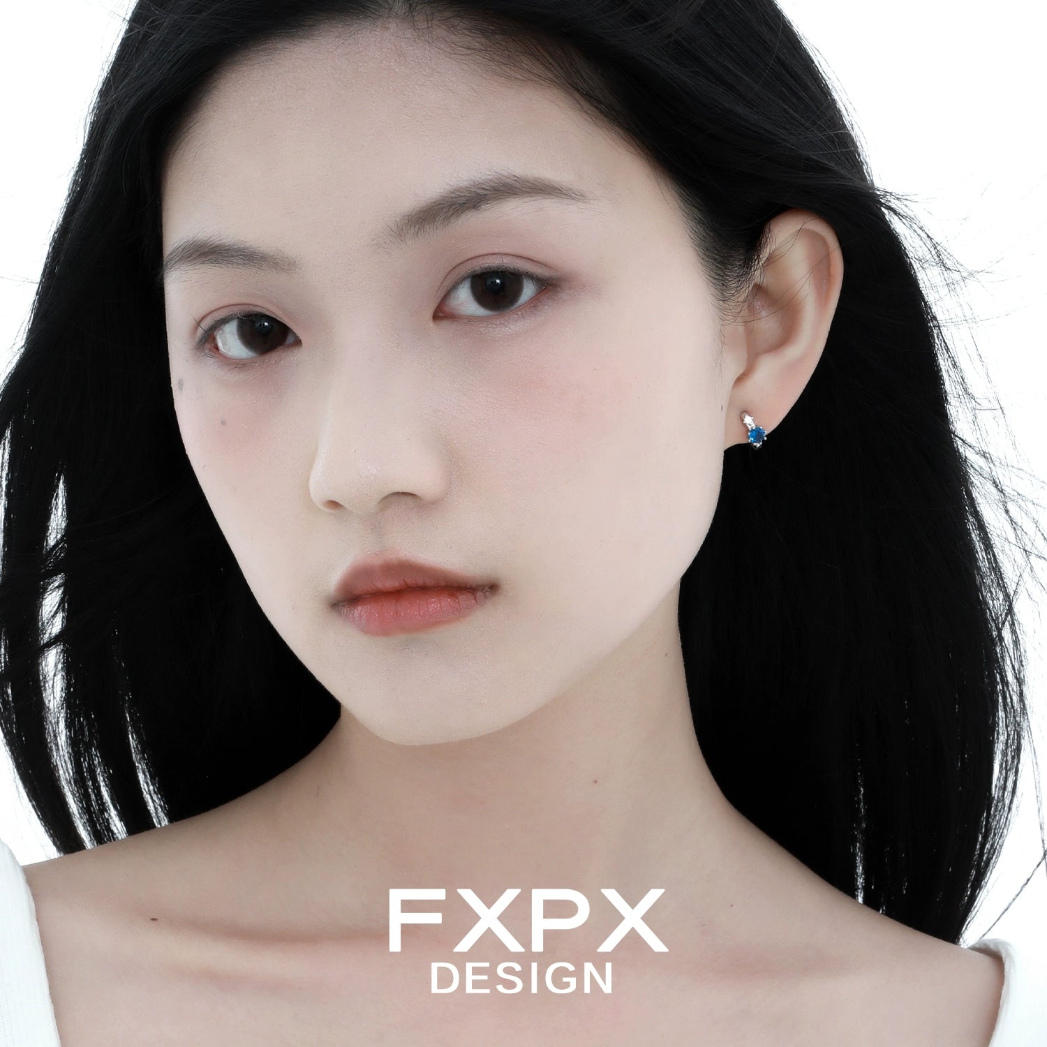 Elegant blue zircon earrings displayed on a model, perfect for enhancing any outfit