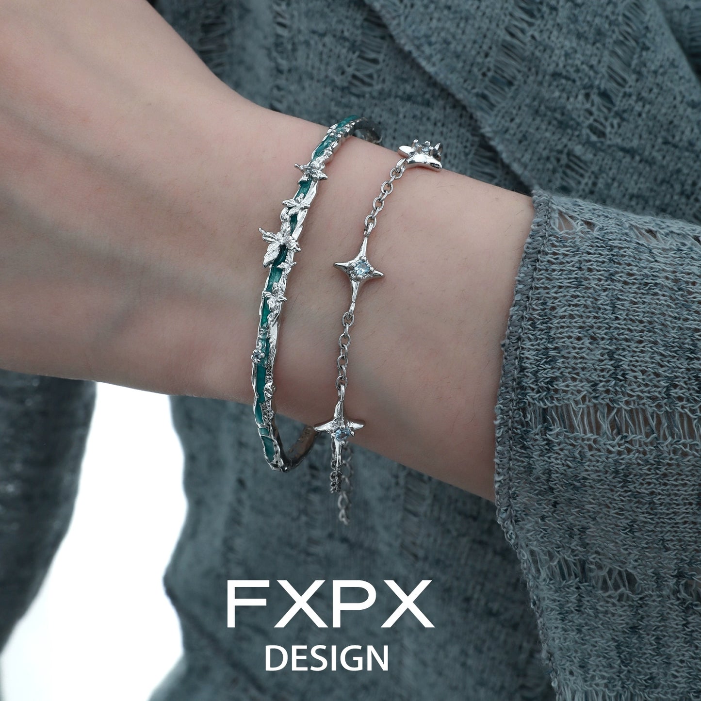 FXPX butterfly double layer bracelet with delicate star accents worn on a model's wrist