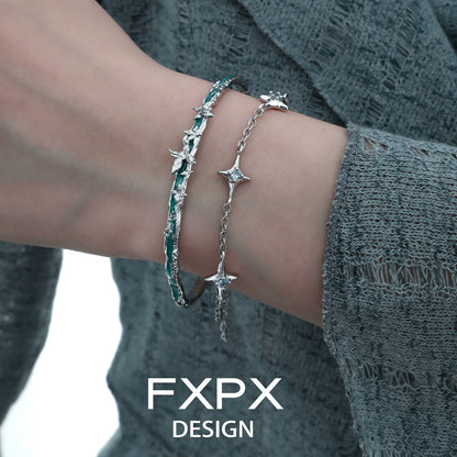 FXPX butterfly double layer bracelet with delicate star accents worn on a model's wrist