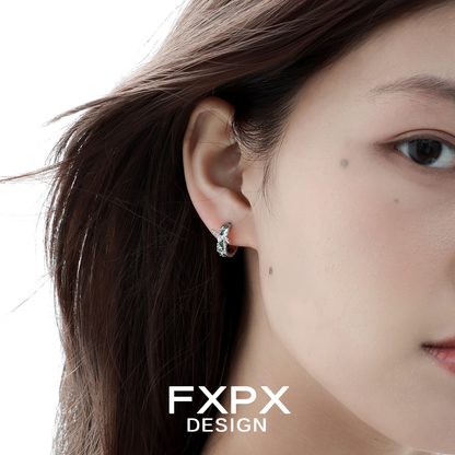 Elegant FXPX butterfly hoop earrings showcased on a model's ear with a stylish design