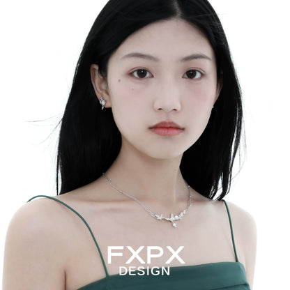 Elegant butterfly pearl earrings by FXPX featuring a delicate design with shimmering details