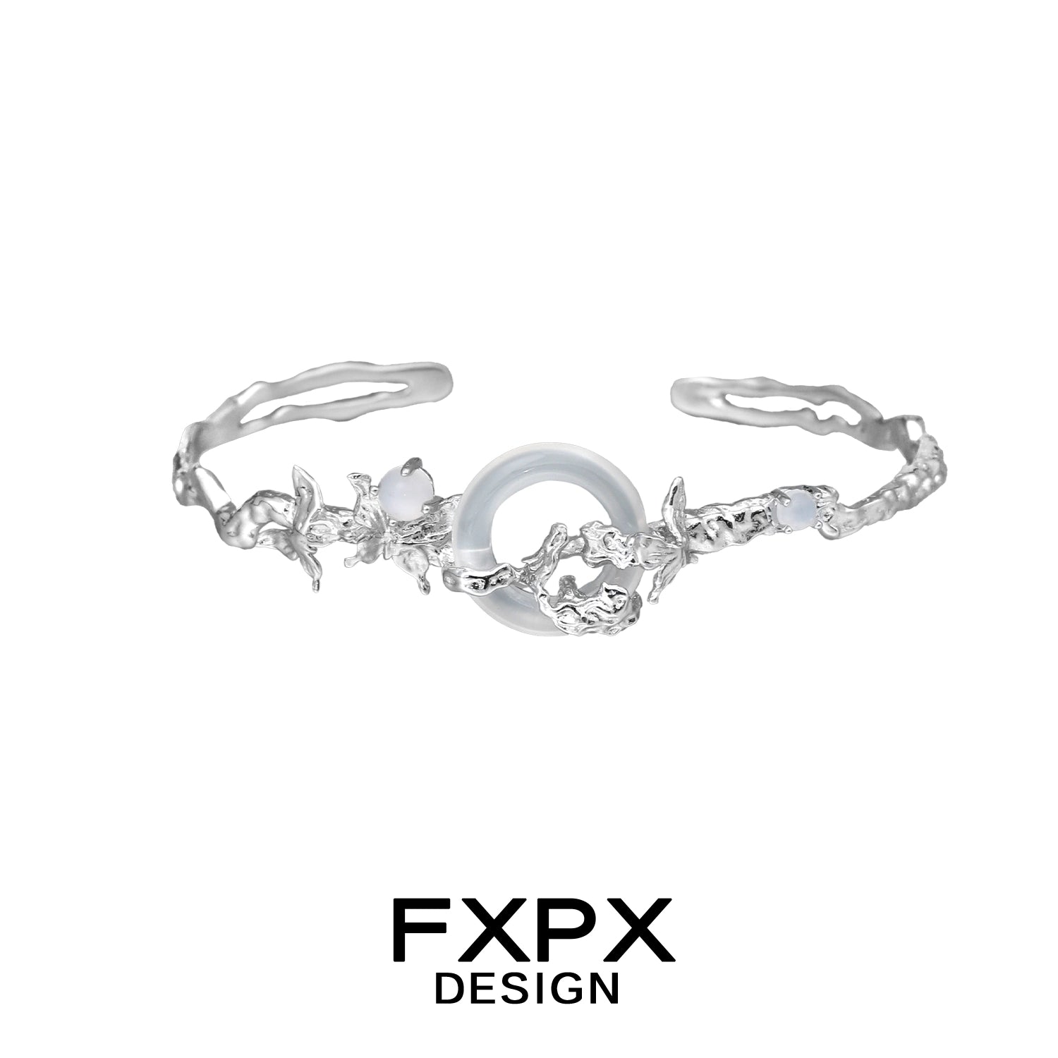 Elegant FXPX butterfly sigil bracelet with intricate floral designs and a central gemstone