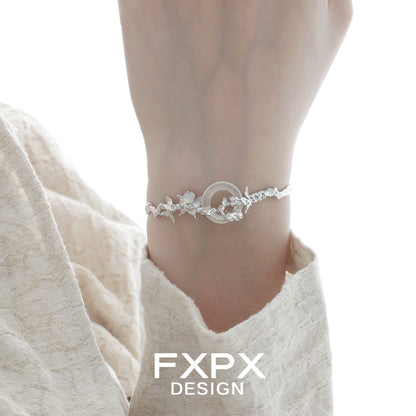 Elegant butterfly sigil bracelet designed by FXPX, featuring a delicate floral pattern