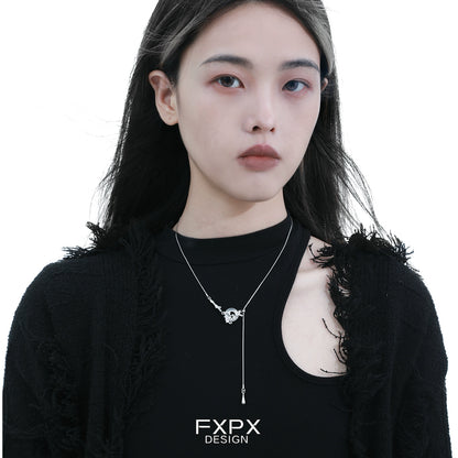 Fashion model wearing a celestial eclipse agate necklace in a sleek design and modern aesthetic