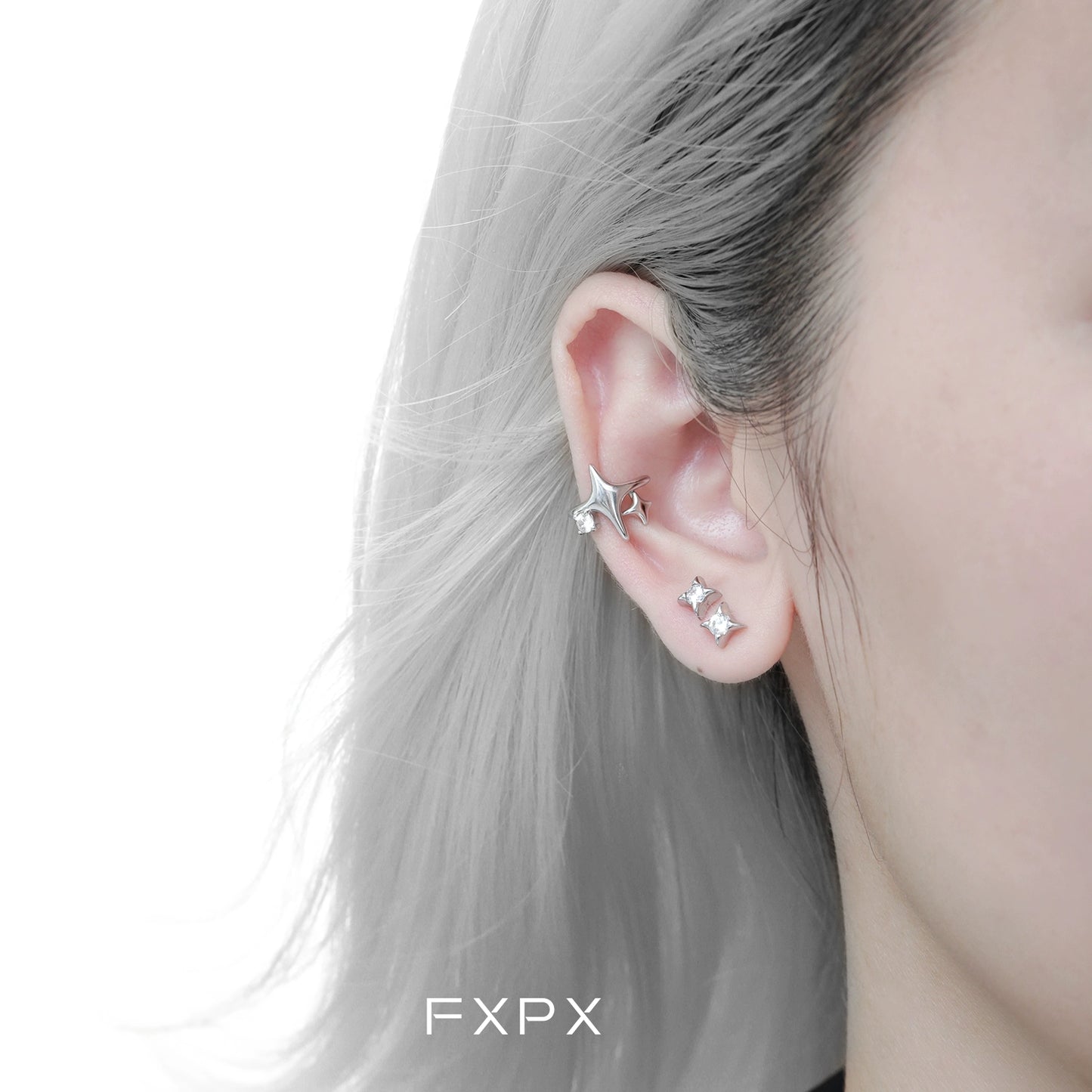 FXPX celestial star ear cuffs featured on an ear with a sleek design and elegant shine