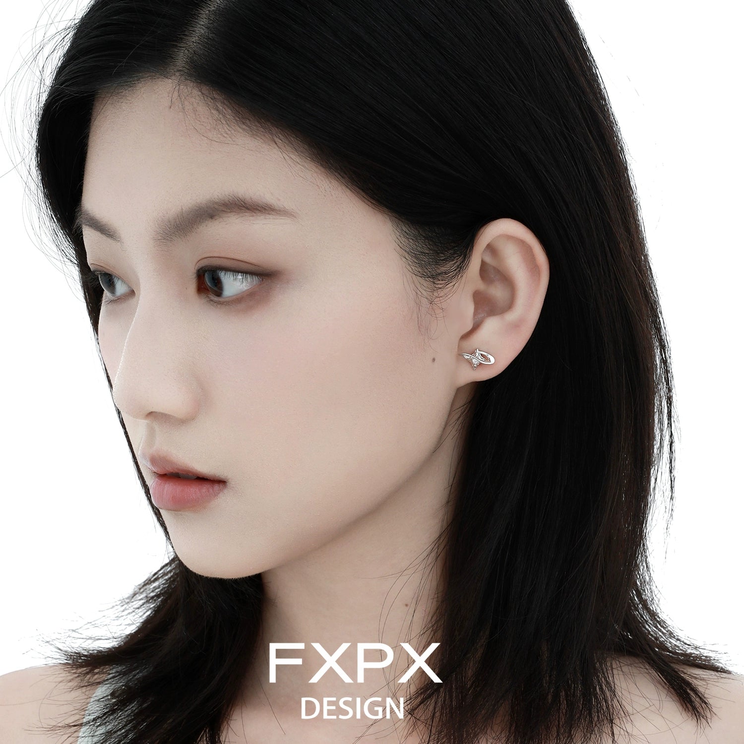 Stylish FXPX celestial star earrings showcased on model with sleek black hair