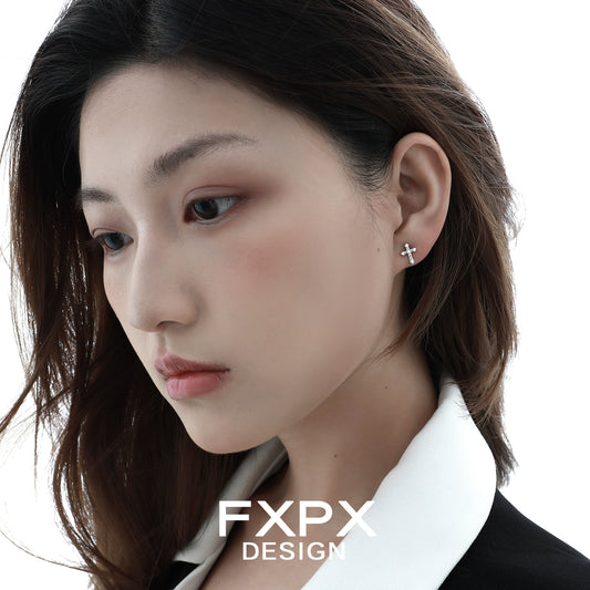 Elegant FXPX cross zircon earrings displayed on a model showcasing their stylish design