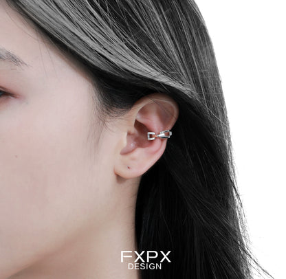 Stylish FXPX cyber mech silver earrings showcased on a model's ear for a modern look