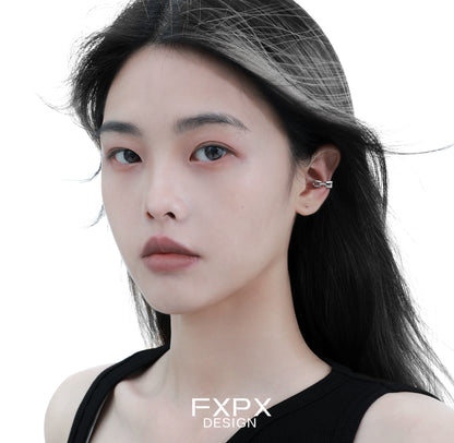 Stunning FXPX cyber mech silver earrings showcased on a model with stylish hair