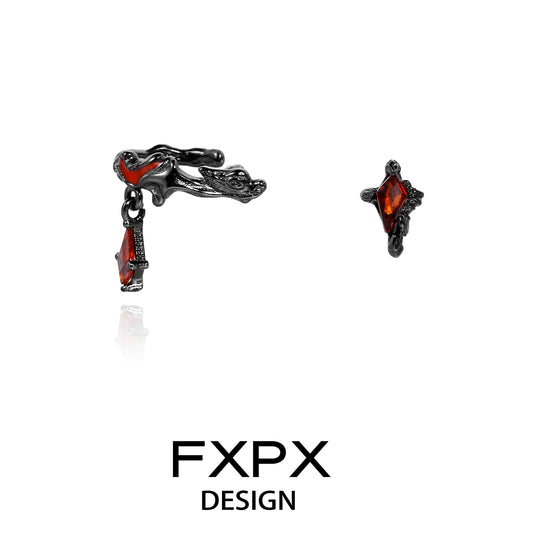 FXPX dark devil heart earrings featuring black metal design and red gemstone accents
