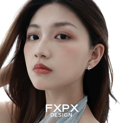 Elegant mirror butterfly silver earrings showcased on a model's ear with soft lighting